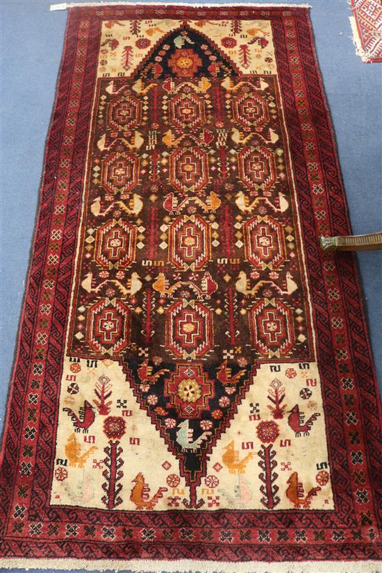 A Persian Kazak red ground rug, 200 x 100cm